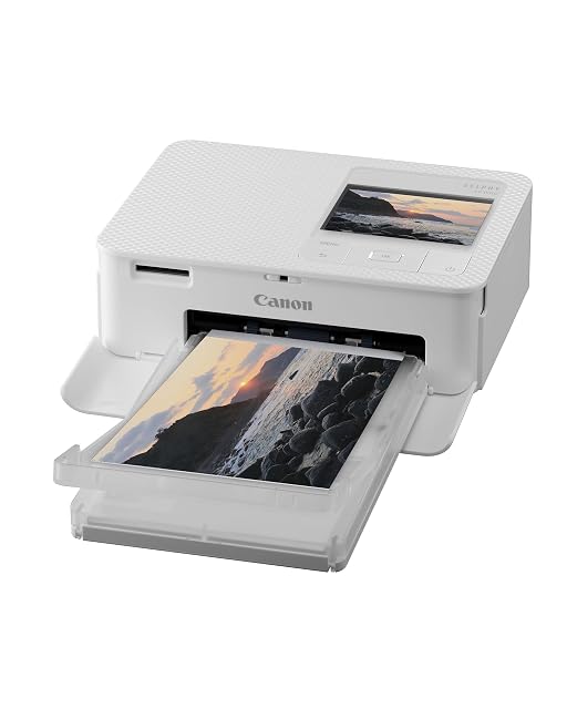 Canon SELPHY CP1500 con la cassetta cartolina inserita e lo schermo LCD acceso